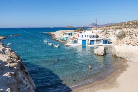 Houses and boats in Mytakas beach, Milos, Greeceの写真素材