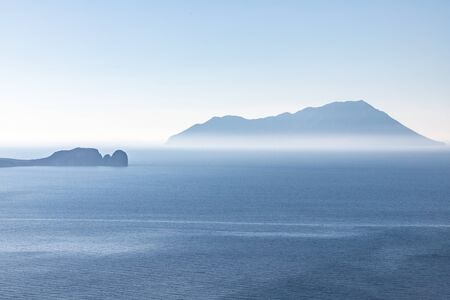 Fog in Islands in Milos bay, Milos, Greece