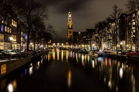 Night lights of church, building and channels in Amsterdan, Nederlandsの写真素材