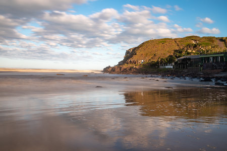 Beach and Furnas cliffs in background, Torres, Rio Grande do Sul, Brazilの写真素材