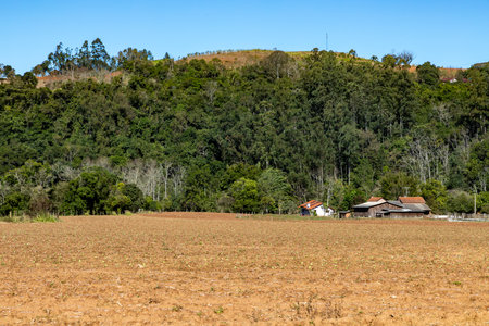 Soil prepared for plantation with forest and mountain around, Monte Alverne, Rio Grande do Sul, Brazilの写真素材