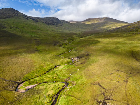 Aerial view of river, mountains and fields in Dromalonhurt, Kerry, Irelandの写真素材