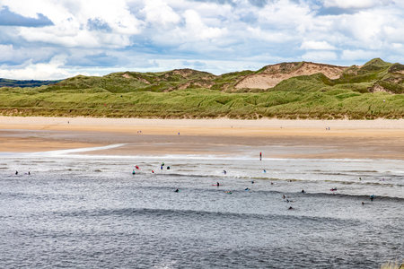 Surfers in Tullan Strand, Bundoran, Donegal, Ireland