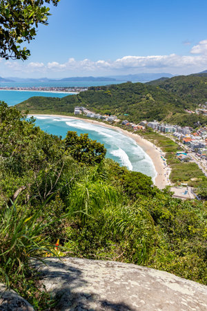 Quatro Ilhas beaches with buildings, mountains, forest and Mariscal beach in the background, Santa Catarina, Brazilの写真素材