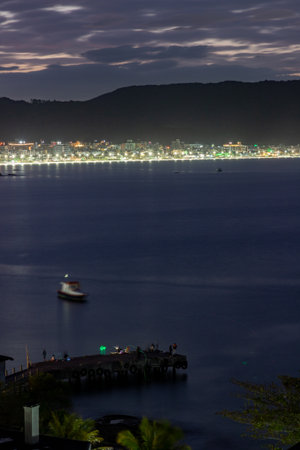 Lights at Bombinhas beach at sunset, Santa Catarina, Brazilの写真素材