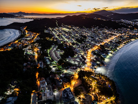 Aerial view of Bombinhas beach night lights at sunset, Bombinhas, Santa Catarina, Brazilの写真素材