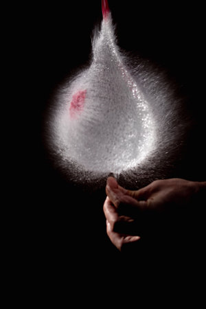 water-filled balloon at the moment of bursting when puncturedの写真素材
