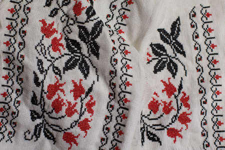 Embroidery with red and black flowers. Handmade traditional embroidery. Vintage background....