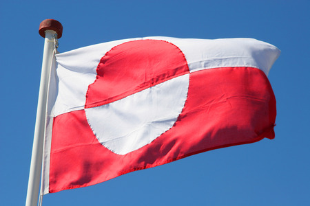 Close up of the National flag of Greenland  With a red   white half circle の写真素材