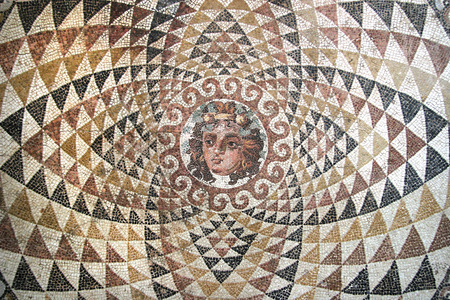 Mosaic of Dionysos, from the ruins of central panel from tesselated floor of a Roman villa (second half 2nd Century BCE). Depicted is Dionysos with fruit and ivy in his hair. Corinth, Greece.の写真素材