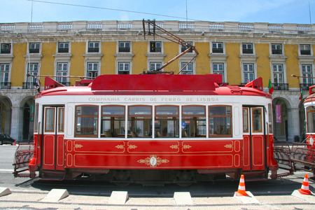 Traditional red tram in Praca do Comercio (or Commerce Square), Lisbon, Portugal.のeditorial素材