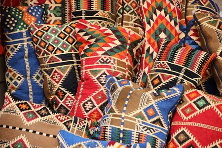 Bright colorful material or fabric designs in typical bold patterns of the Middle East, Aqaba, Jordan.の写真素材