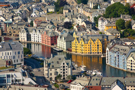 Close up of the beautiful buildings in the town centre from above. Art nouveau architecture and canals from the viewpoint Aksla, Alesund, Norway.の写真素材