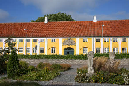 Kaalund Monastery is located in Kalundborg Municipality, Denmark. Historic yellow and white landmark building with gardens in the foreground.の写真素材