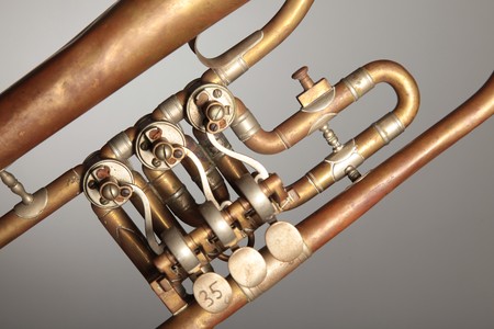 The valves and pipes of an old trumpet.の写真素材