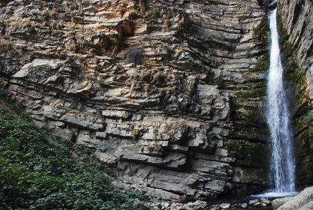 Mountain waterfall in the mountains of Tien Shanの写真素材