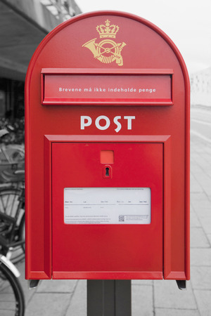 Danish mail box with inscriptions about work on a black and white backgroundのeditorial素材