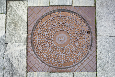 Cover of the manhole with natural stoneの写真素材