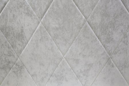 Background of gray velvet with a screed line in the form of a diamond