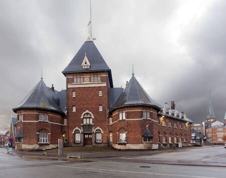 An old red brick building on the waterfront in Aarhus at dusk. Denmarkのeditorial素材