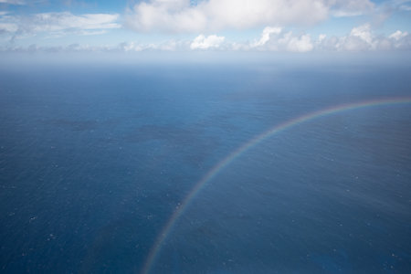 Hawaiian Rainbow crossing a dreamy seascapeの写真素材