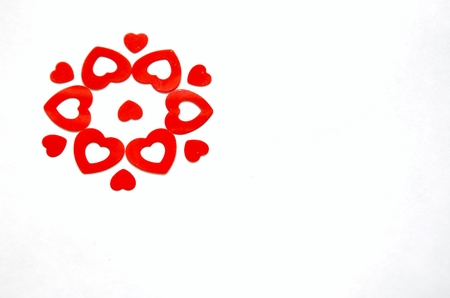 flower created with red heart shaped confettiの写真素材