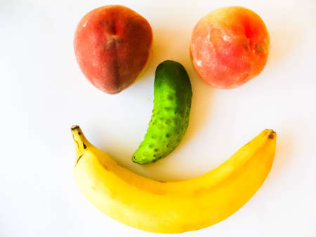 Face made out of different fruits, isolated on whiteの写真素材