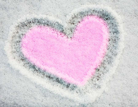 White snow with drown pink heart shapeの写真素材
