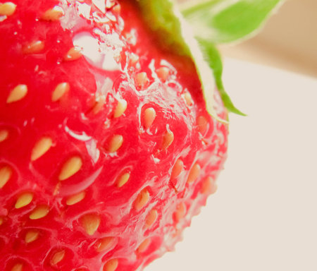 Strawberries on yellow wood backgroundの写真素材