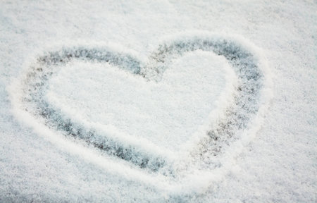 White snow with drown heart shapeの写真素材