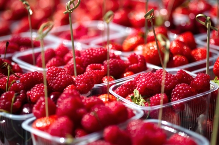 Tasty raspberries served in a plastic glasses.の写真素材