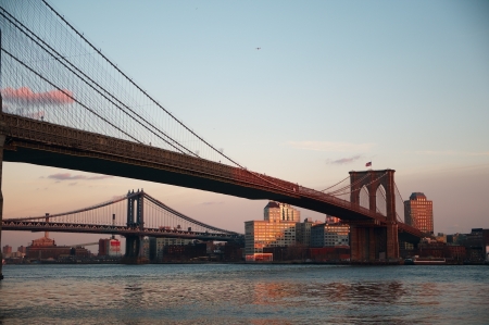 Brooklyn and Manhattan bridges across East River in New York City の写真素材