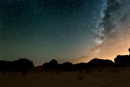 Milky way above red Wadi Rum desert in Jordan.