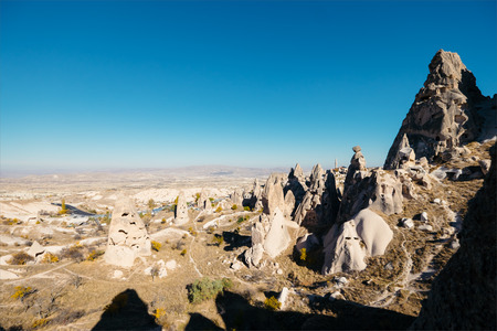 Cave dwelling and columbariums at the valley of Uchisar town. Cappadocia, Turkey.の写真素材