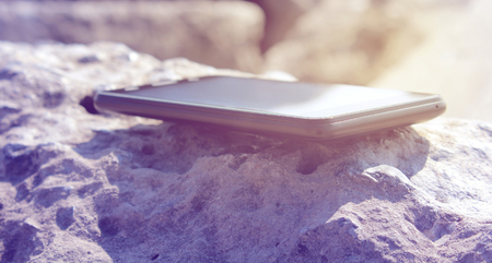 Medern Smartphone on a stoneの写真素材