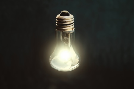Light bulb on blackの写真素材
