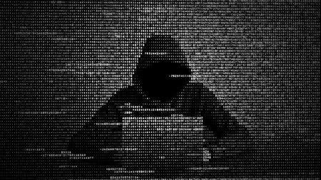 Hacker in data security concept. Hacker using laptop. Hacking the Internet. Cyber attack.