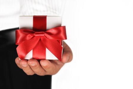 Male hand holding a gift boxの写真素材