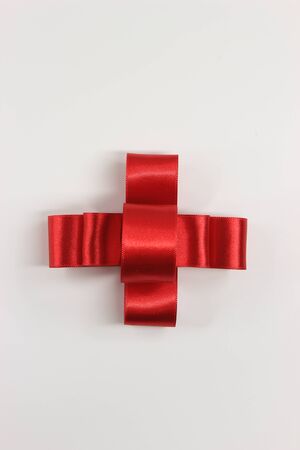 Red ribbon bow, top viewの写真素材