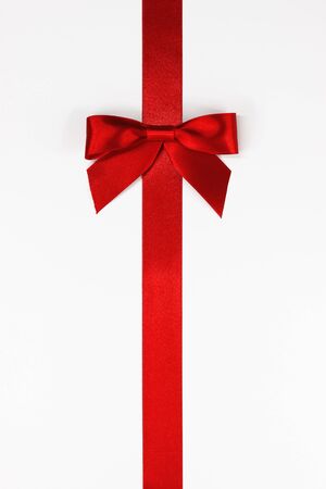 Red ribbon and bow on white backgroundの写真素材