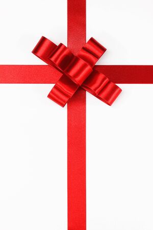 Red ribbon and bow on white backgroundの写真素材