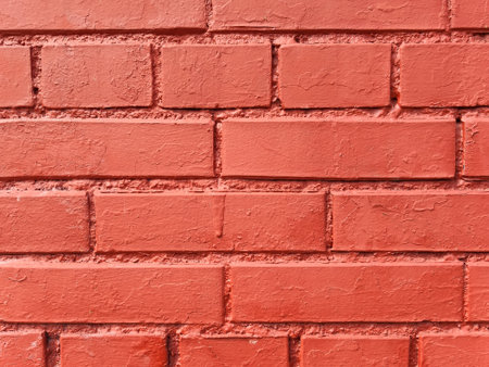 Textured brick wall made of red stone, painted brick. Rectangular background for mockups, paintings, posters.の写真素材
