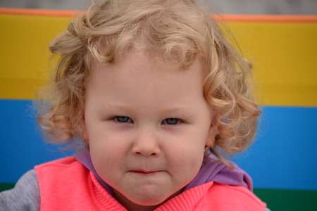 girl curly blond hair on