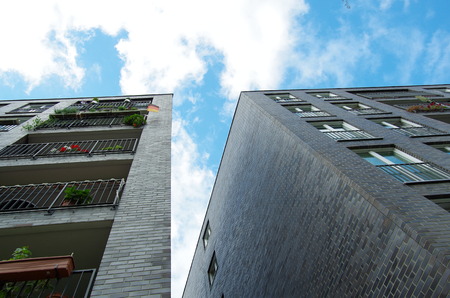 residential high-rise buildings and blue sky with clouds