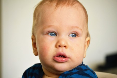 baby with blue eyes looking