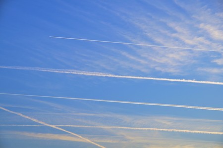 strip from the plane on a blue skyの写真素材