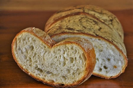 Wheat bread baked on a wooden brown table