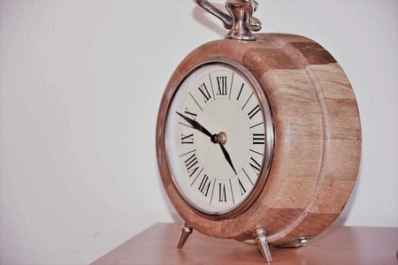 table clock round wooden with roman numeralsの写真素材