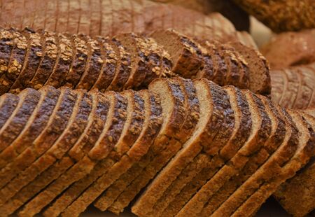 Sliced rye bread in bread slicerの写真素材