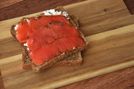 piece of bread with curd and fillet red fishの写真素材